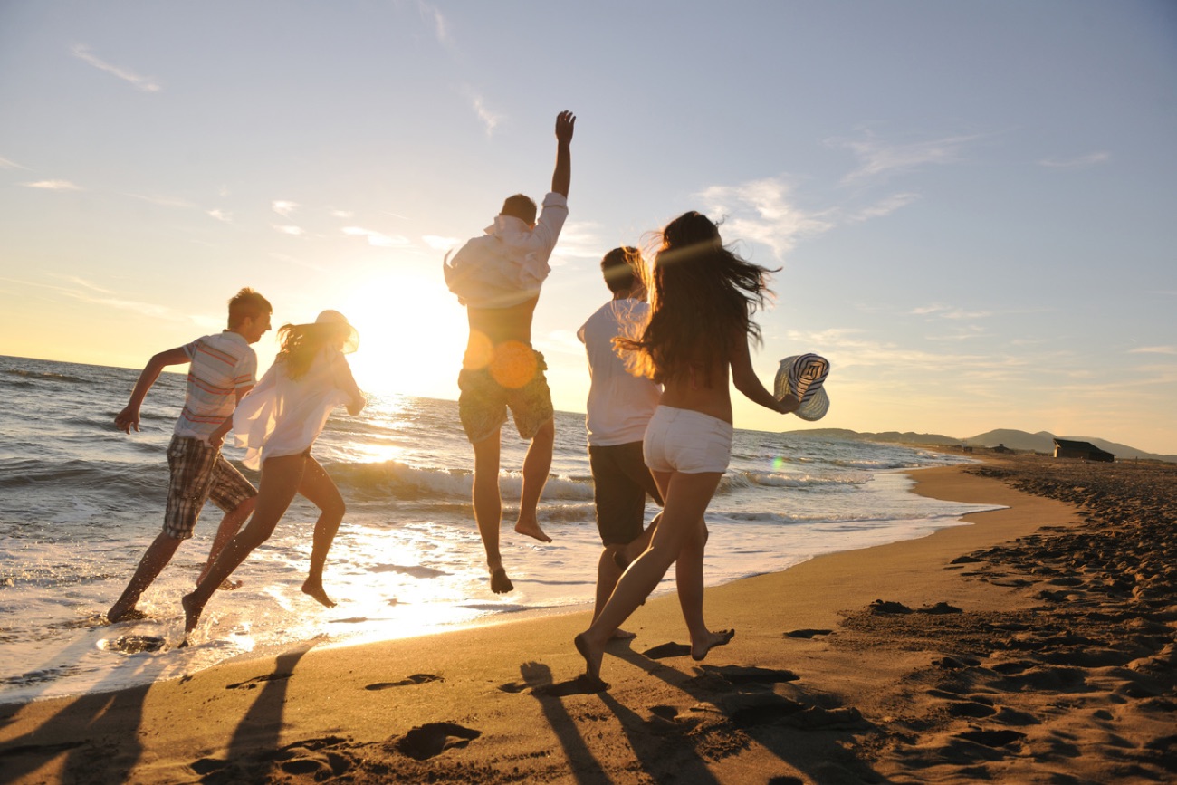 Friends enjoying a weekend getaway on the beach